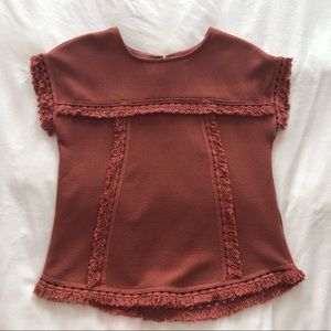 Rusty colored blouse with precious detail!